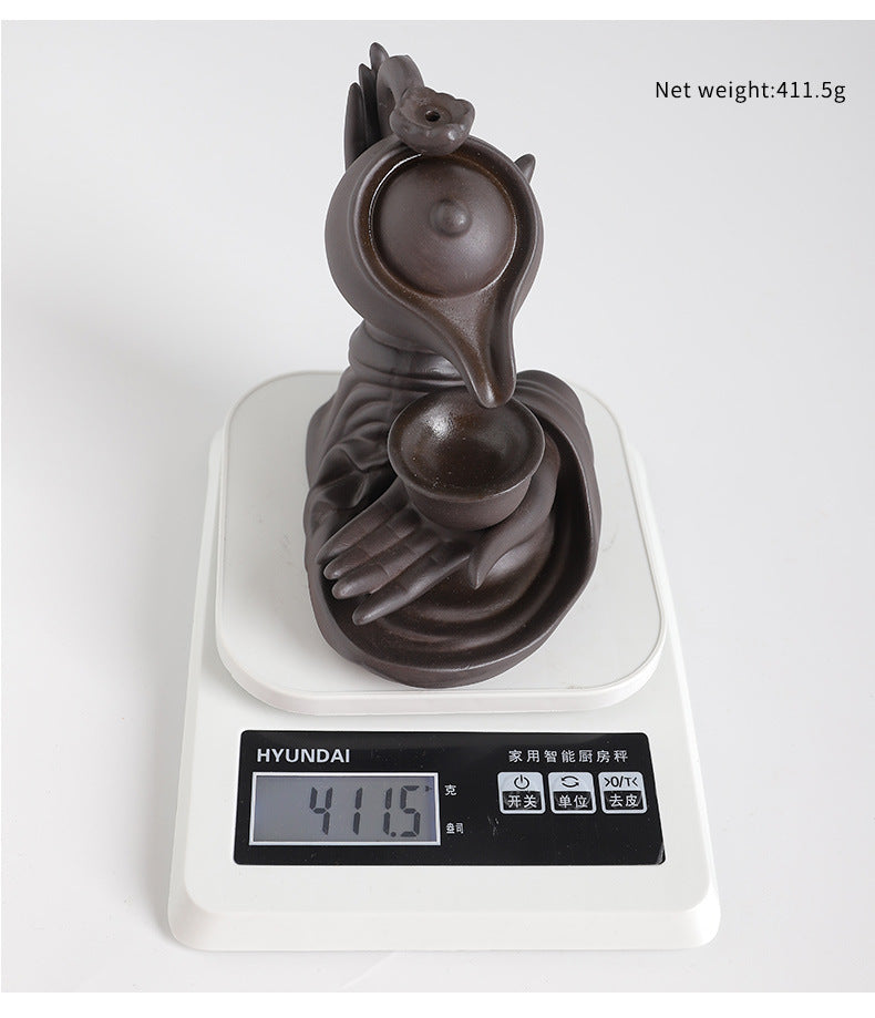 Zen-Inspired Handheld Teapot for Aromatherapy and Relaxation